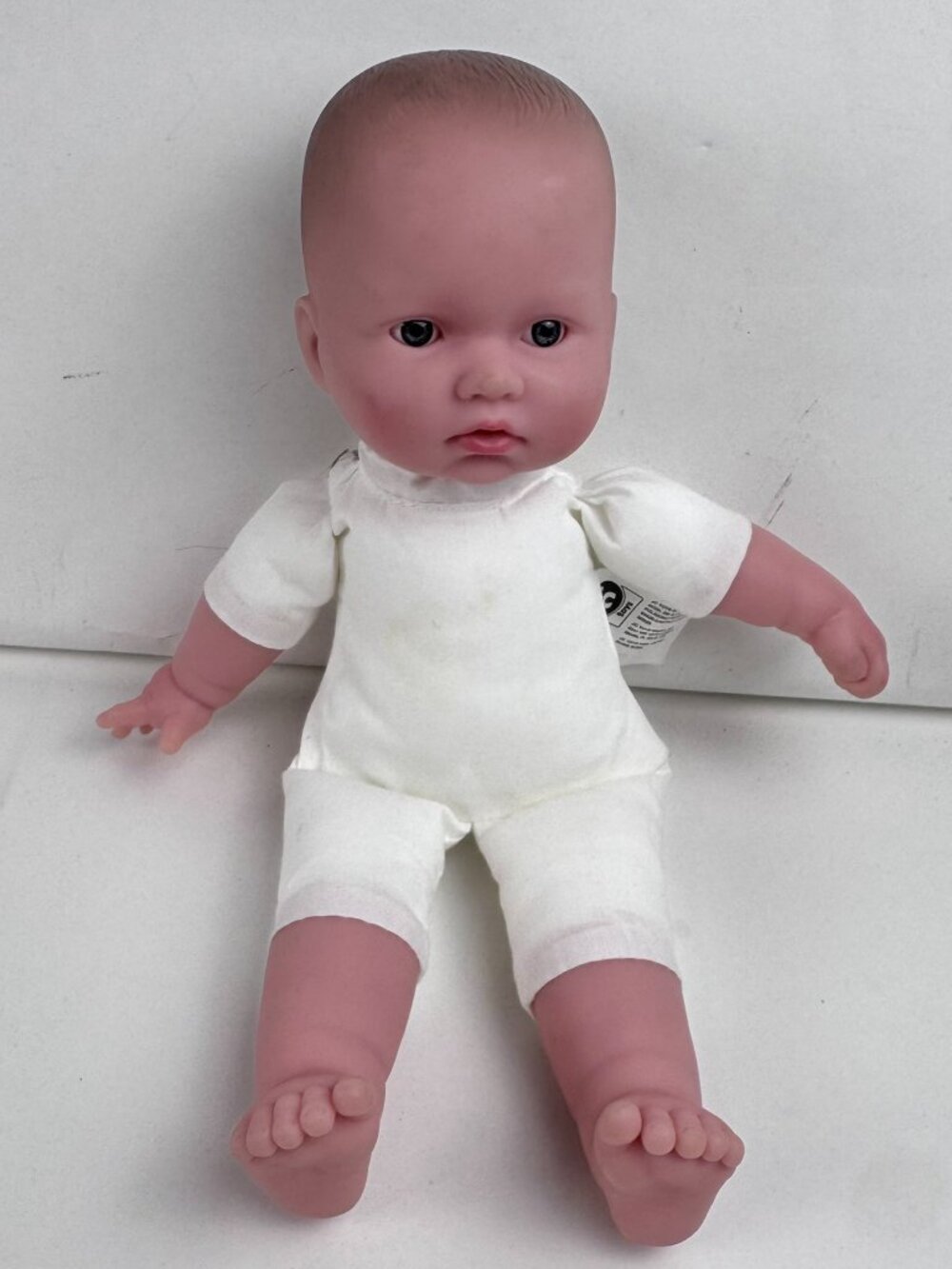 Berenguer 10" Baby Doll Soft Body Molded Hair Blue Eyes White Romper Stains